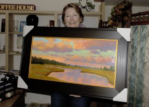 A Hartwell House Inn guest shows off her latest acquisition - A mary Byrom painting purchased at Beth Ellis Cove Gallery in Perkins Cove, Ogunquit 
